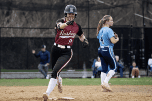 Barbara Jo Coppola celebrates a sixth-inning homer against Ursuline on April 4. The Huskies fell 3-2 against a good Koalas squad.